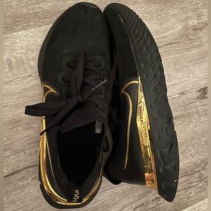 Women’s Nike Infinity React Custom Running Shoe - Black with Metallic Gold.